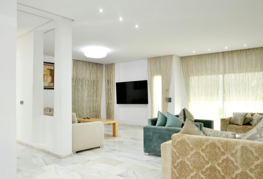 Spacious modern living room with elegant sofas and stylish decor.